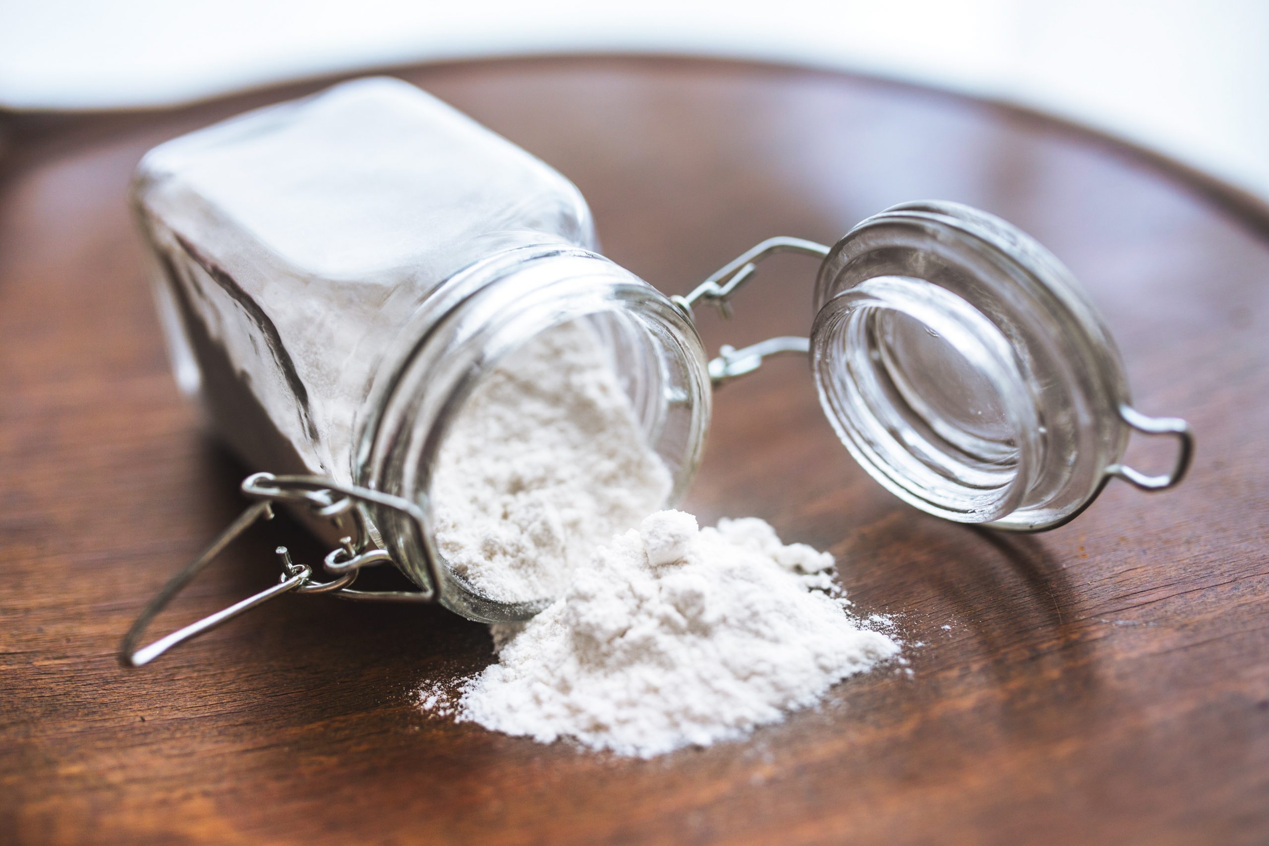 Baking soda, Sodium bicarbonate in glass bowl on wooden table